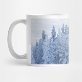 Trees covered in snow Mug